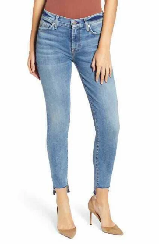 women's blue denim bell-bottoms -The Ankle Super Skinny Step Raw Hem Denim Jeans In Blue